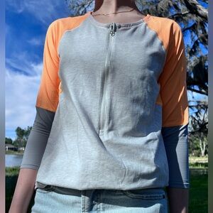 Lululemon 3/4 Orange and grey athletic shirt.